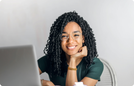 Smiling woman with laptop