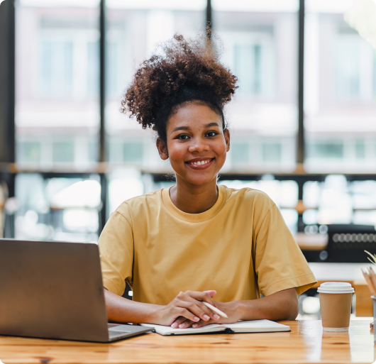 Person smiling in a virtual coaching session